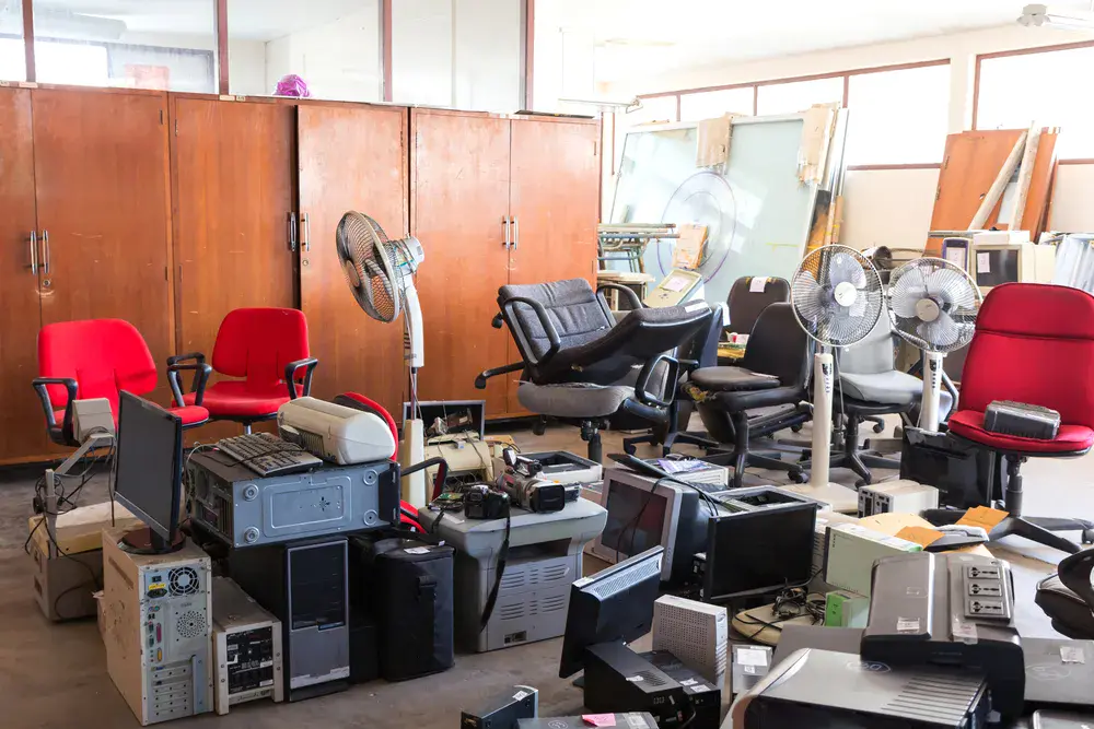 Office furniture and equipment temporarily stored in self storage during renovation to save workspace and prevent clutter